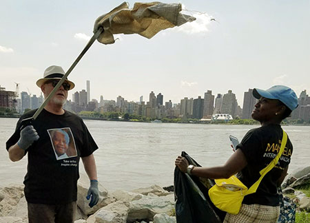 UN staff cleaning the shorelines of litter and invasive plants