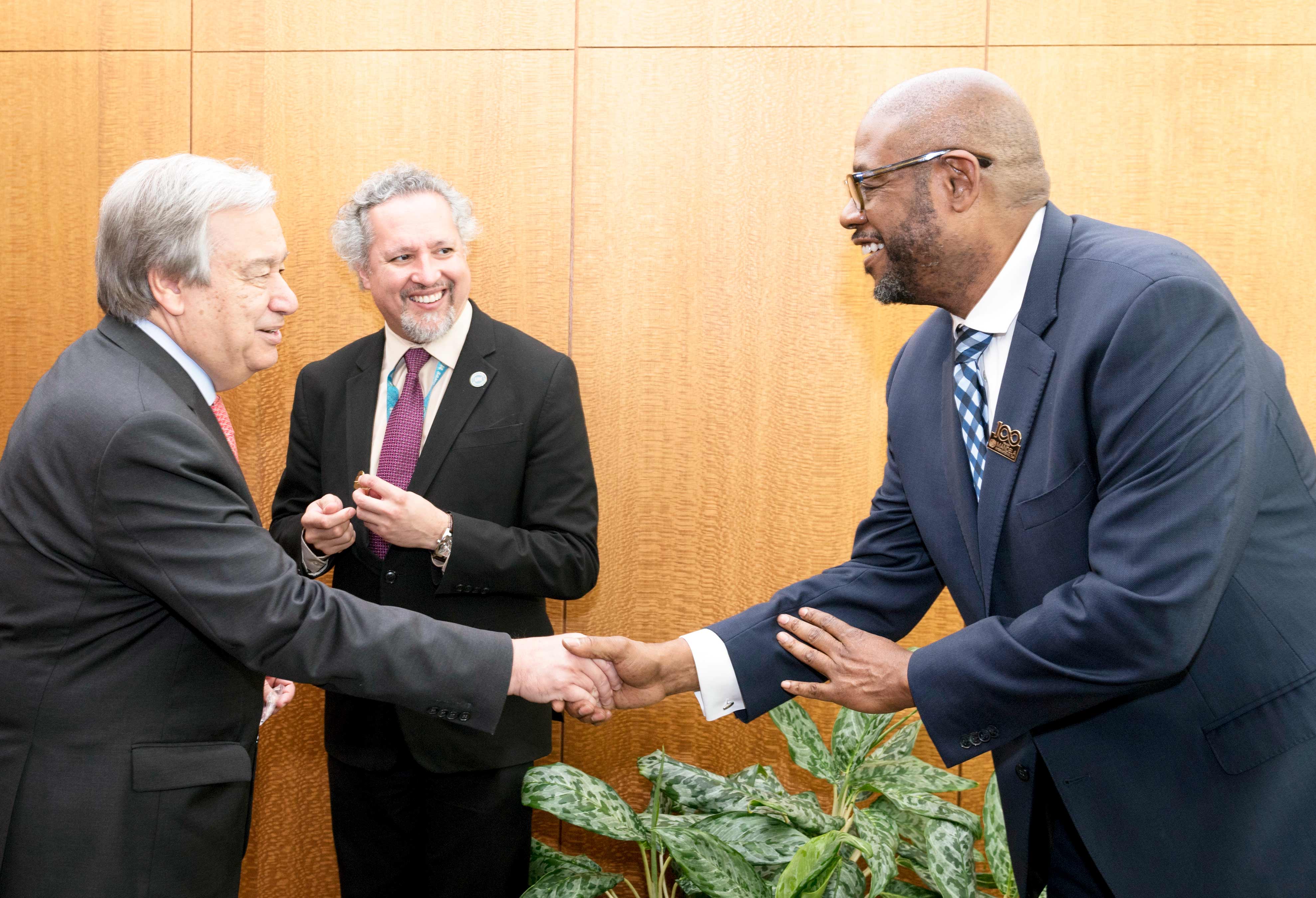 Secretary-General António Guterres (left) greets Forest Whitaker, UNESCO Special Envoy for Peace and Reconciliation and SDG Global Advocate. © UN Photo/Rick Bajornas