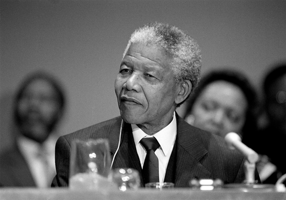 Nelson Mandela, President of the African National Congress, addresses a press conference where he called for a "phased maintenance" of sanctions.