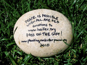 rock with inscription "peace is possible when all are fed"