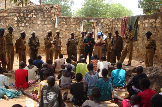 United Nations corrections officers and Sudanese officials talk to female inmates in the women's section of the Torit prison in Southern Sudan, 2008. UN Photo