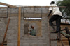 An UNMIS Corrections Officer from Zimbabwe works to re-build offices and a records storage facility in the Juba Central Prison in Southern Sudan, 2010. UN Photo/Tim McKulka