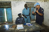 A UN police officer discusses the situation in a detention center run by the local police in Nasser, Upper Nile State, Sudan, 2010. UN Photo/Paul Banks