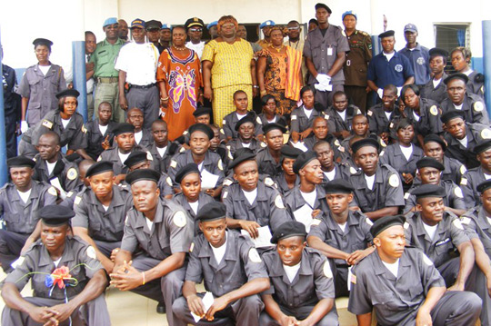 Deputy Special Representative of the SG, Henrietta Mensa-Bonsu, and UN corrections officers participate in a graduation ceremony for Liberian prison guards, trained by UNMIL, 2009.  UN Photo