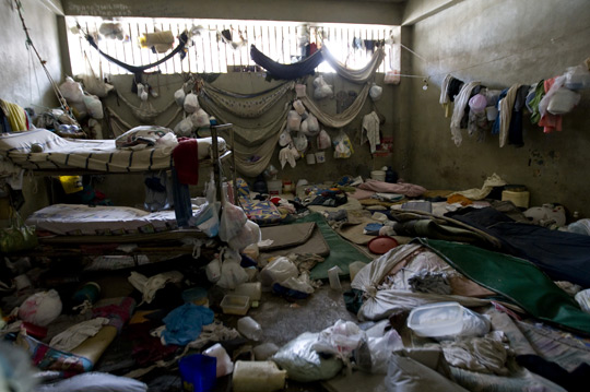 A room with two beds accommodates dozens of prisoners at Haiti’s Central Prison. Overcrowded and filthy prisons are the norm in many poor countries, especially those emerging from conflict, 2011. UN Photo/ Logan Abassi