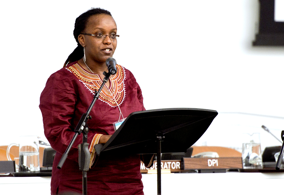 A performer reads letters during the memorial ceremony.