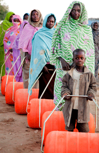 Displaced Darfuris Receive Efficient Water Rollers. UN Photo/Albert Gonzalez Farran