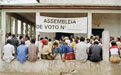 Voters in front of a voting station