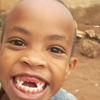 Gisimba’s youngest son smiling. Gisimba’s four children are very precious to him.