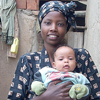 A mother holding her baby.
