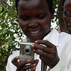 Godelieve photographs Annociata taking pictures of other women. Annociata is one of the twelve participants that took part in Visions of Rwanda project. She is a survivor of the 1994 genocide and receives counseling from Godelieve.