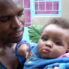 A father holding his son.