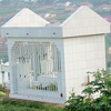 A photograph of a cemetery represents the friends and family members that Guy Christian lost in the 1994 genocide.