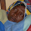 Guy Christian photographs his mother resting during a period when she was sick. She has been the only parental figure in his life and is very important to him.