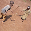 Two little children play with each other.