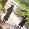 Children play under a bridge.