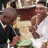 Joseph photographs a wedding. The groom and the bride share a traditional drink together.