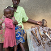 Joseph’s aunt, the sister of his mother, sits beside the remains of Joseph’s mother.