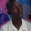 A portrait of Joseph inside his clothing shop.