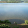 After her family members were killed, Xaverina came to this lake and tried to drown herself. She asked the Lord that if he wanted her to live then he needed to help her get back to shore and miraculously she did. Thacien remembered her story and tried to illustrate it in this photograph.