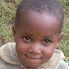 A little girl looks into the camera.