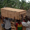 The young woman’s body is being carried away for burial.