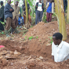Men dig a burial site for the young woman who died.