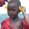 A little girl plays in front of Xaverina's home. There are always many children around her home. Xaverina is greatly respected in her community and is known as a loving woman that always opens her home and heart to many people.